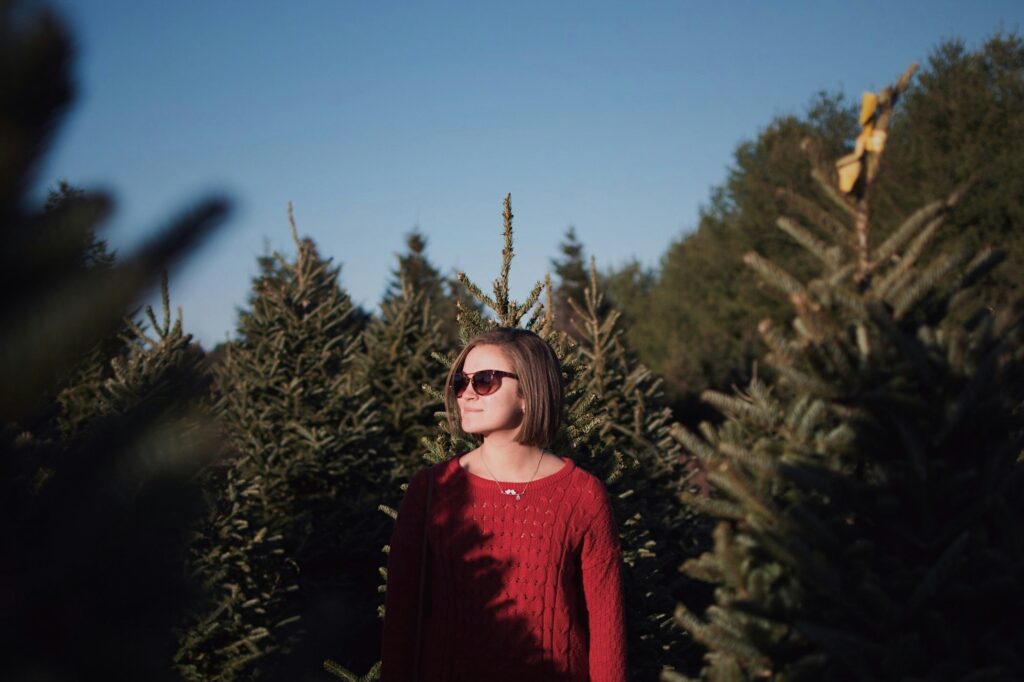 Girl christmas tree farm photoshoot